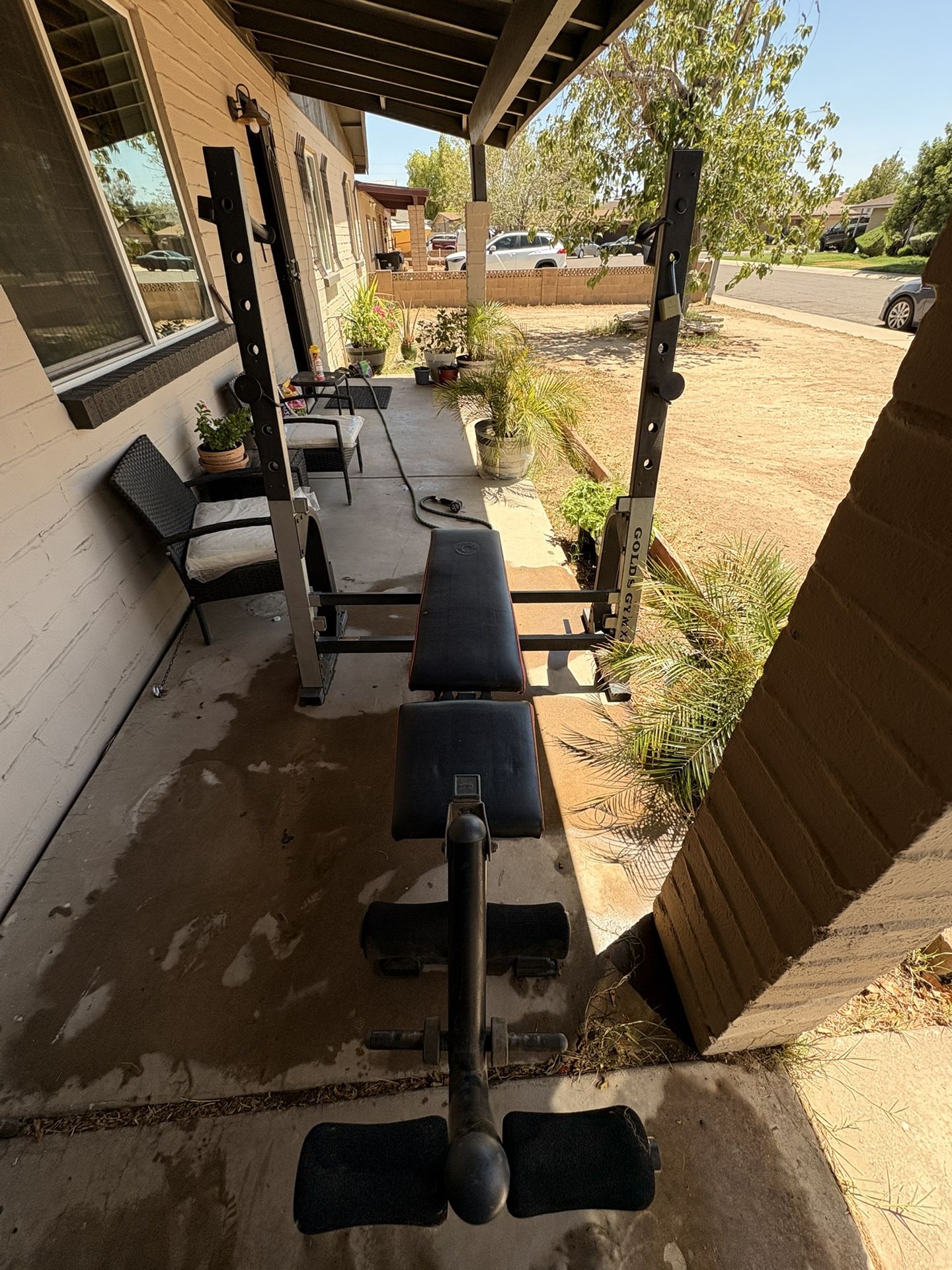 Bench Press Machine And A Lot Of Weights 