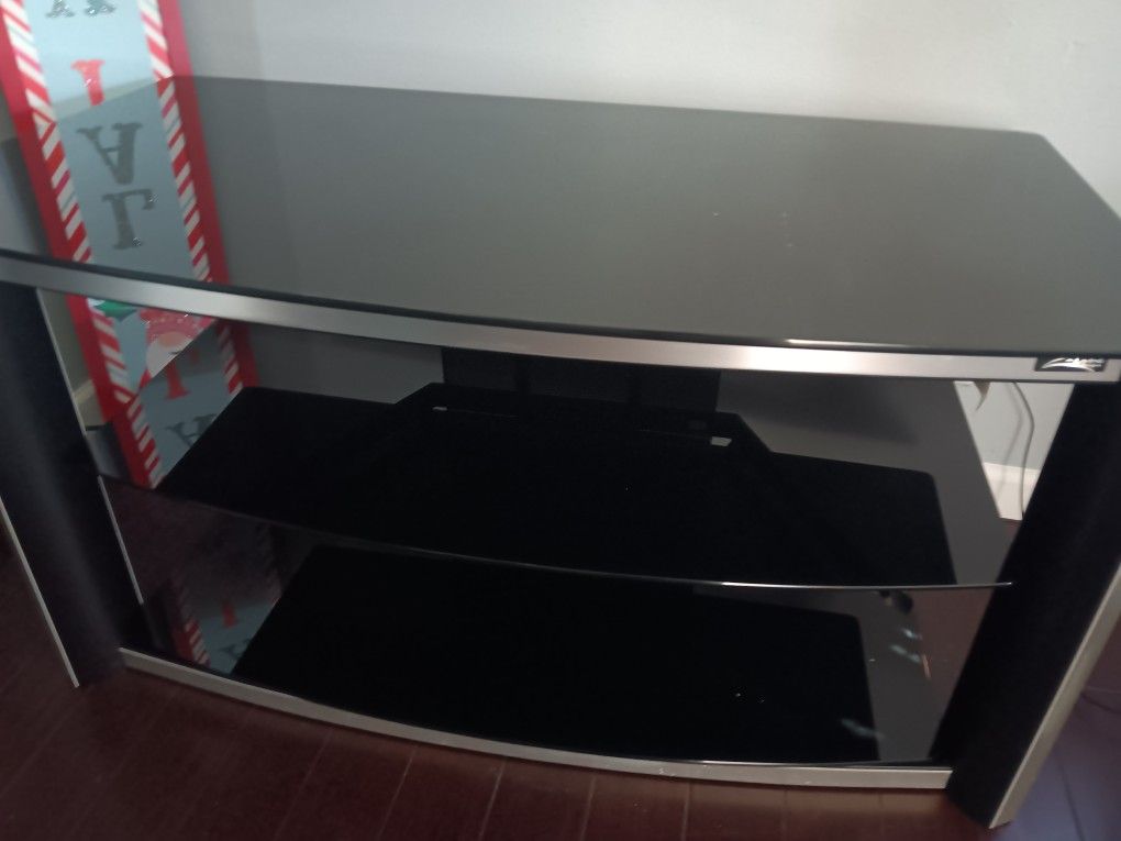 Nice TV stand Black glass fit 43 Inch T.v Serious inquires only. Please
