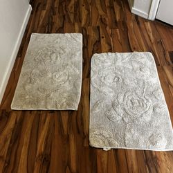 Two Sets Of Two Large Beige Bathroom Floor Mats