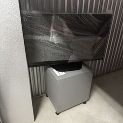 TV , EAMES Office Chair And File Cabinet 