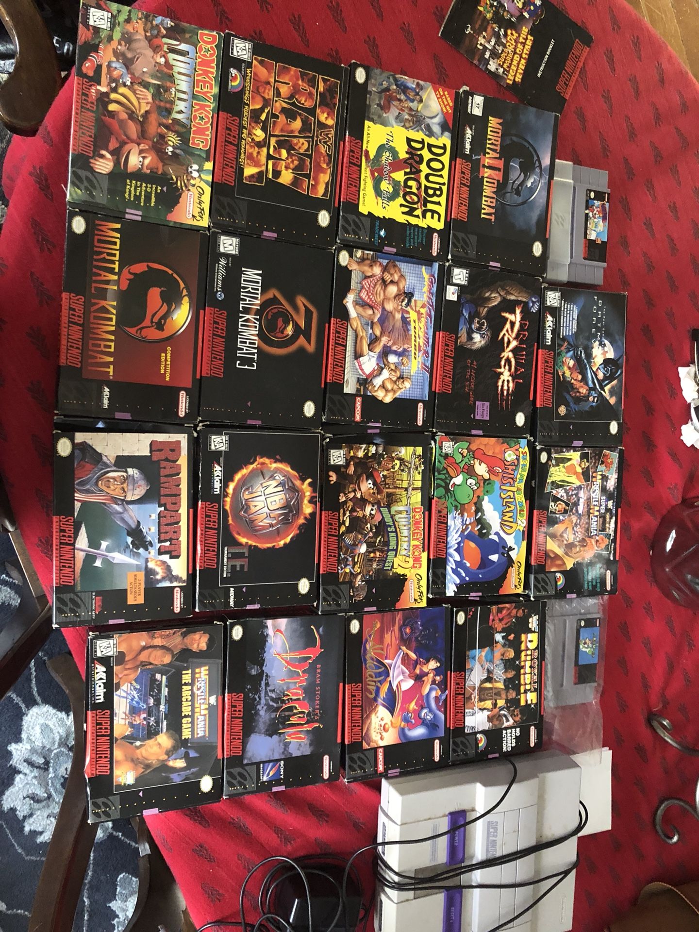 Super Nintendo lot with boxes games system and game book