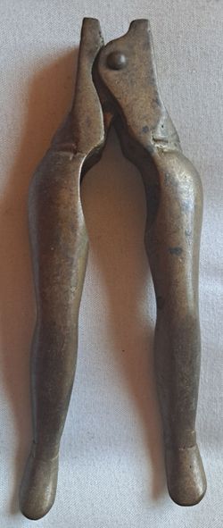 Vintage brass, ladies legs, nutcracker.