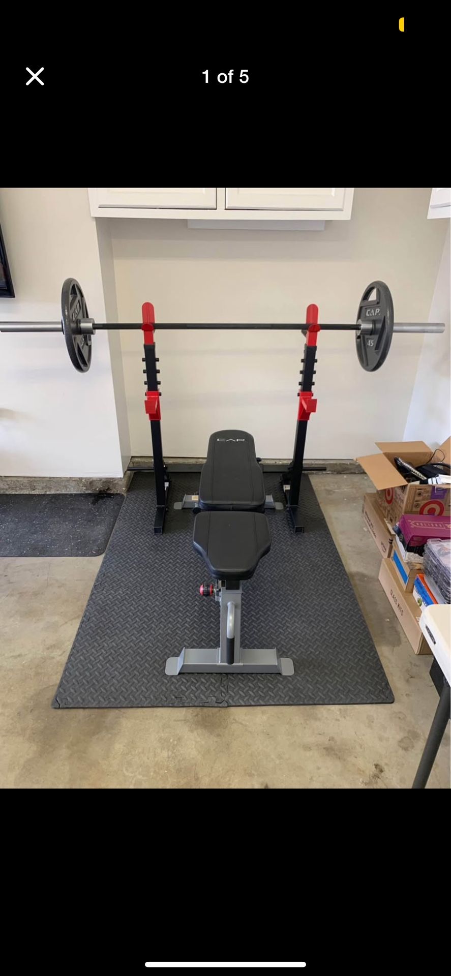 Weight bench, Squat rack, Olympic barbell, two 45 weight plates, weight claps, exercise mat