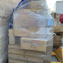 Tall pallets of returned items - e-scooter pet litter box and more