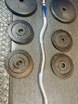 Standard Steel Curl Bar with Cast Iron Weight Plates pairs: 15#, & 4X 5 #. Total: 66 pounds