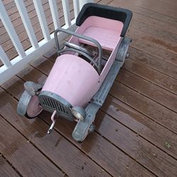 Vintage pink jalopy pedal car