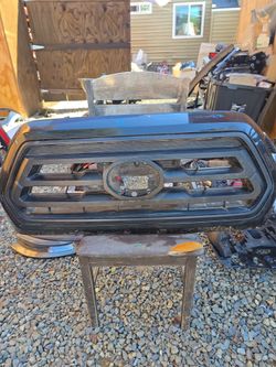 2016-2019 TOYOTA TACOMA GRILLE OEM FRONT CENTER GRILL (contact info removed)040