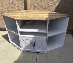 Entertainment center with power/phone charger outlets