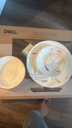 White Dinnerware Set with Red Swirl Pattern