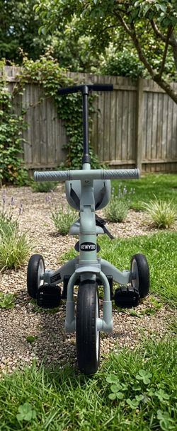 NEWYOO kids convertible tricycle with a push handle