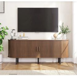 O944 $150  63" TV Stand for 70" TV, Wood Entertainment Center with Storage and Shelves, 2 Sliding Tambour Doors, Mid-Century Modern, Walnut  Fit: For 