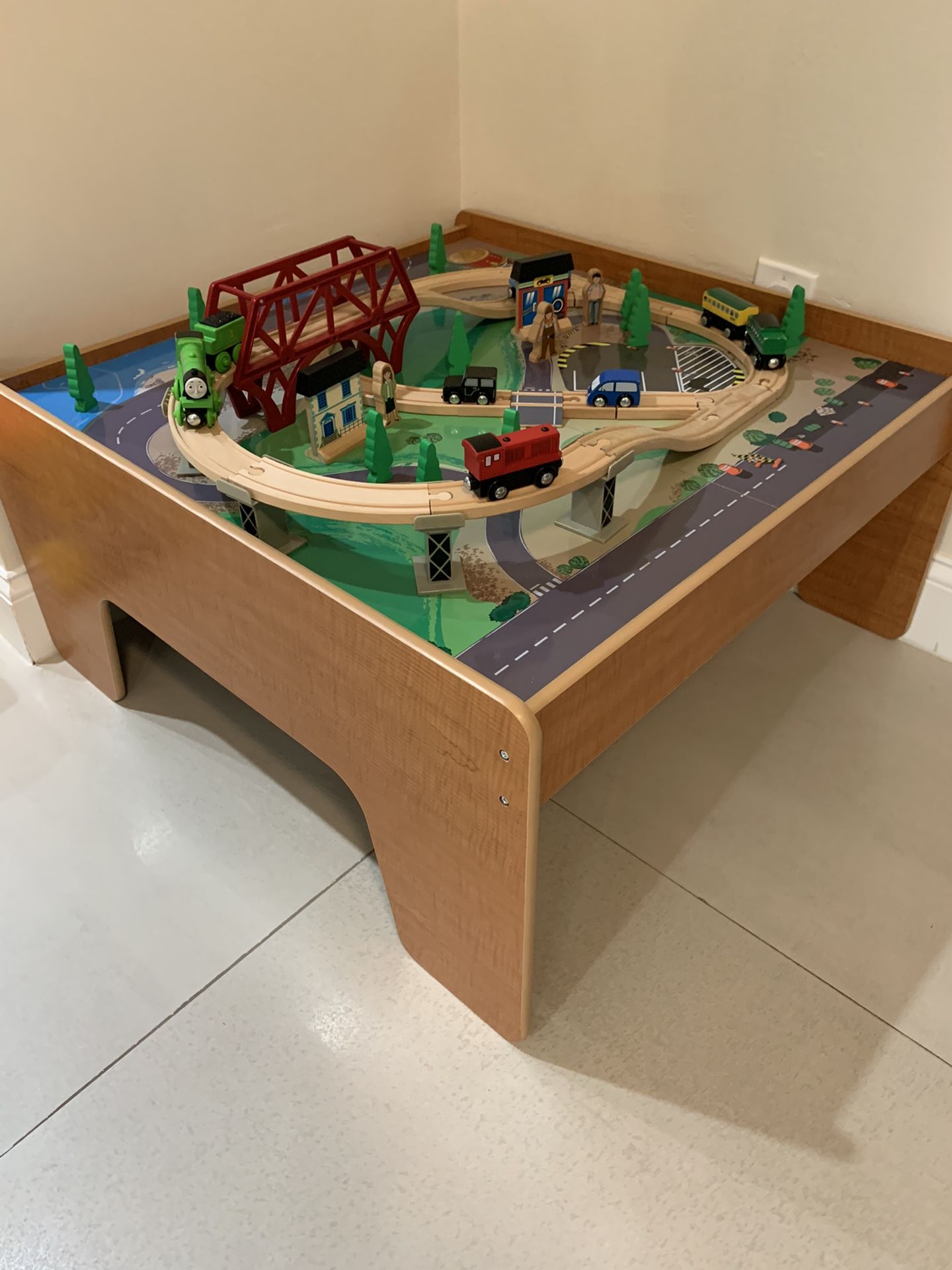 Imaginarium train table with 4 trains and 2 cars