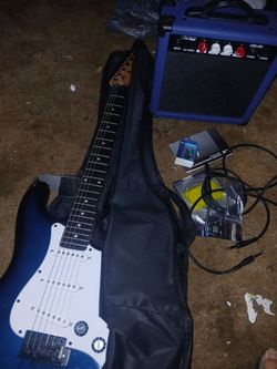 Brand new guitar with amp, tuner, extra strings, and 2 picks