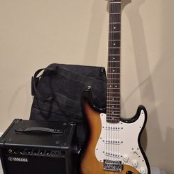 squier by Fender electric guitar with yamaha amp