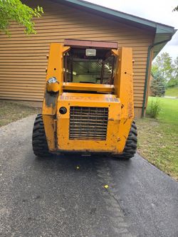 Case skid steer 1845 and trailer