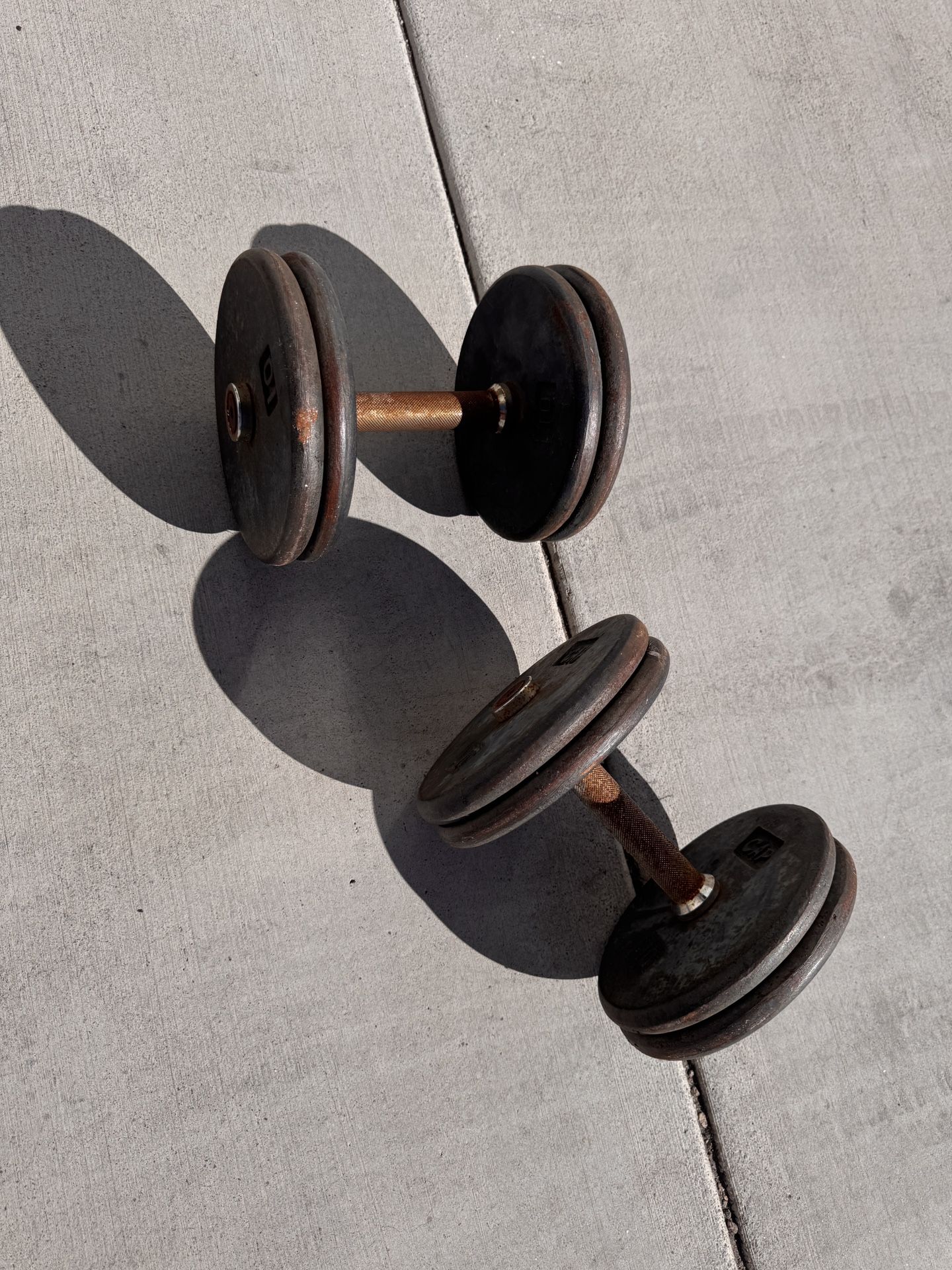 Two Dumbbells With Eight 10 Pound Plates Iron