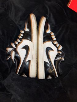 White and black patent leather Nike with a little creasing