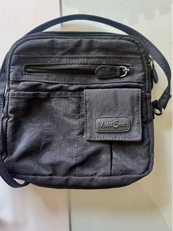 MultiSac cross body purse. Lots of zippered compartments