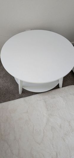 New, white, round coffee table