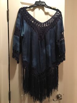 Like new size small top with denim look fabric with fringe.