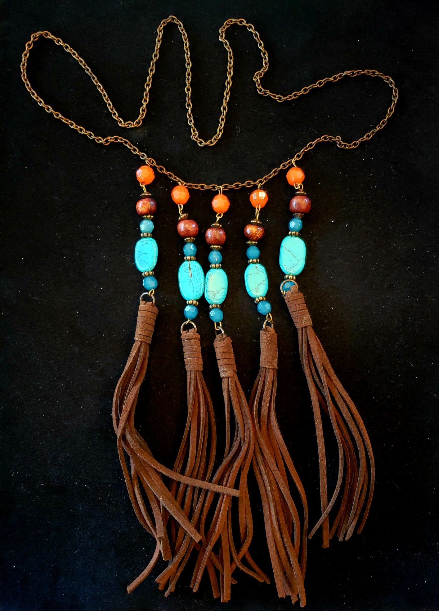 $10. Boho gypsy turquoise rock leather fringe necklace. Necklace is 30 in. Five fringes at 8 in long.