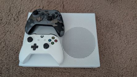 Xbox One S console with 2 controllers