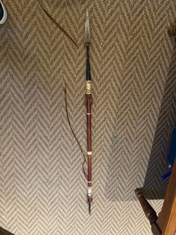 Vintage African spear with decorative leather and woven fiber bindings