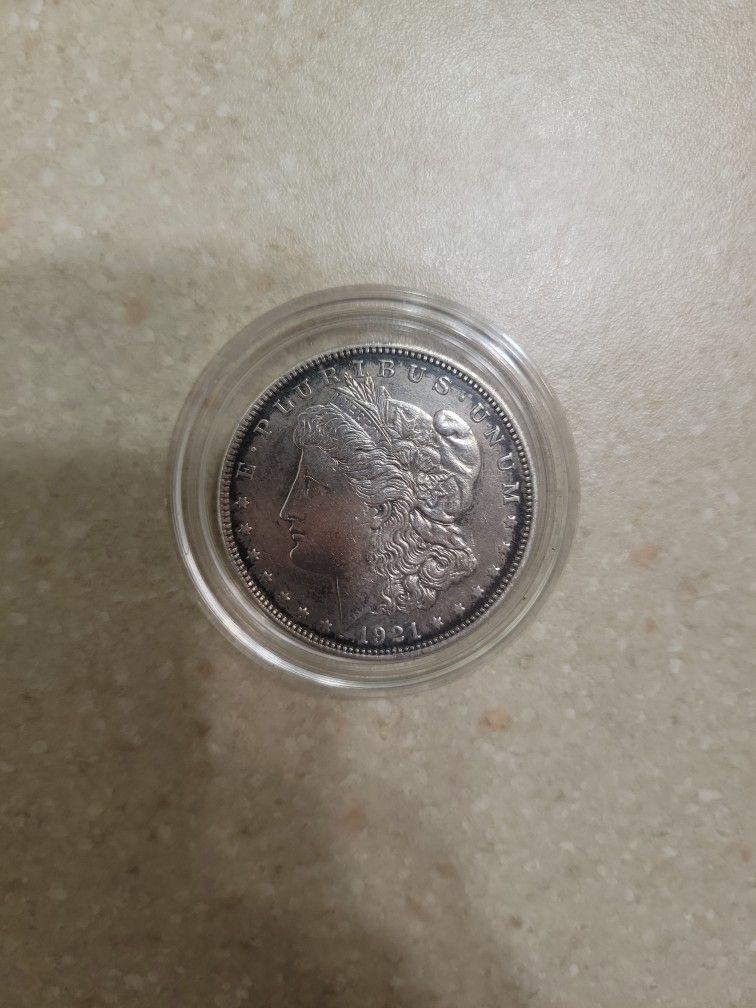 1921 Morgan Silver Dollar. AU