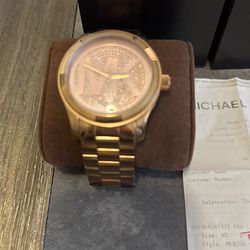 Gold women’s Michael Kors Watch