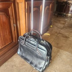 leather briefcase with wheel .