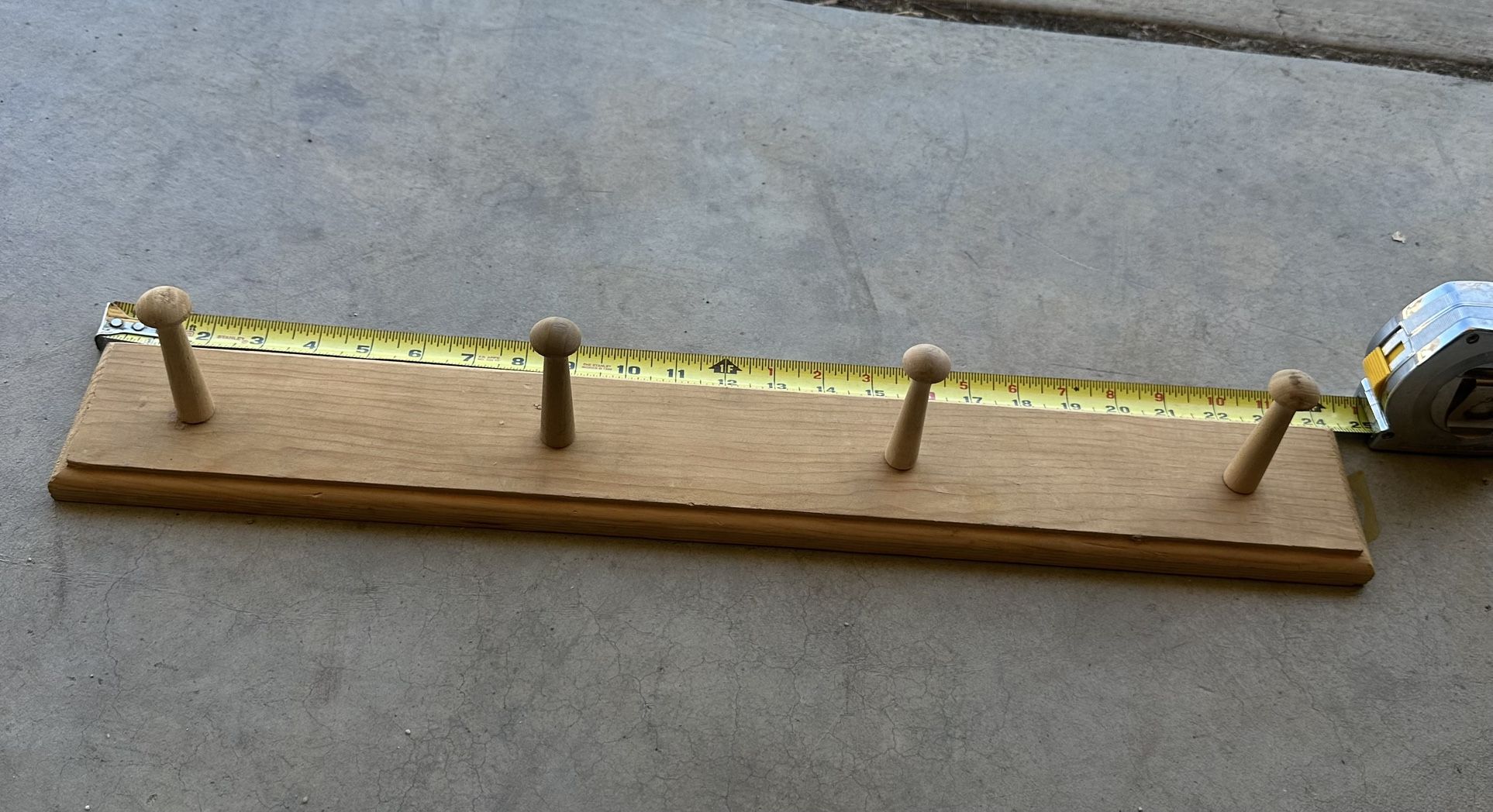Coat Hanger Pegs On Board. Unfinished Wood