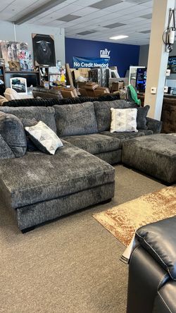In stock today grey left chaise sofa queen sleeper with ottoman was $2499 now $1900. Must sell can deliver can finance