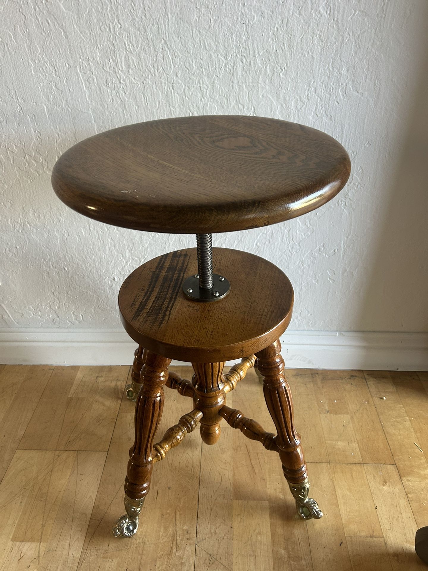 Antique Swivel Stool With Glass Ball and Claw Feet.
