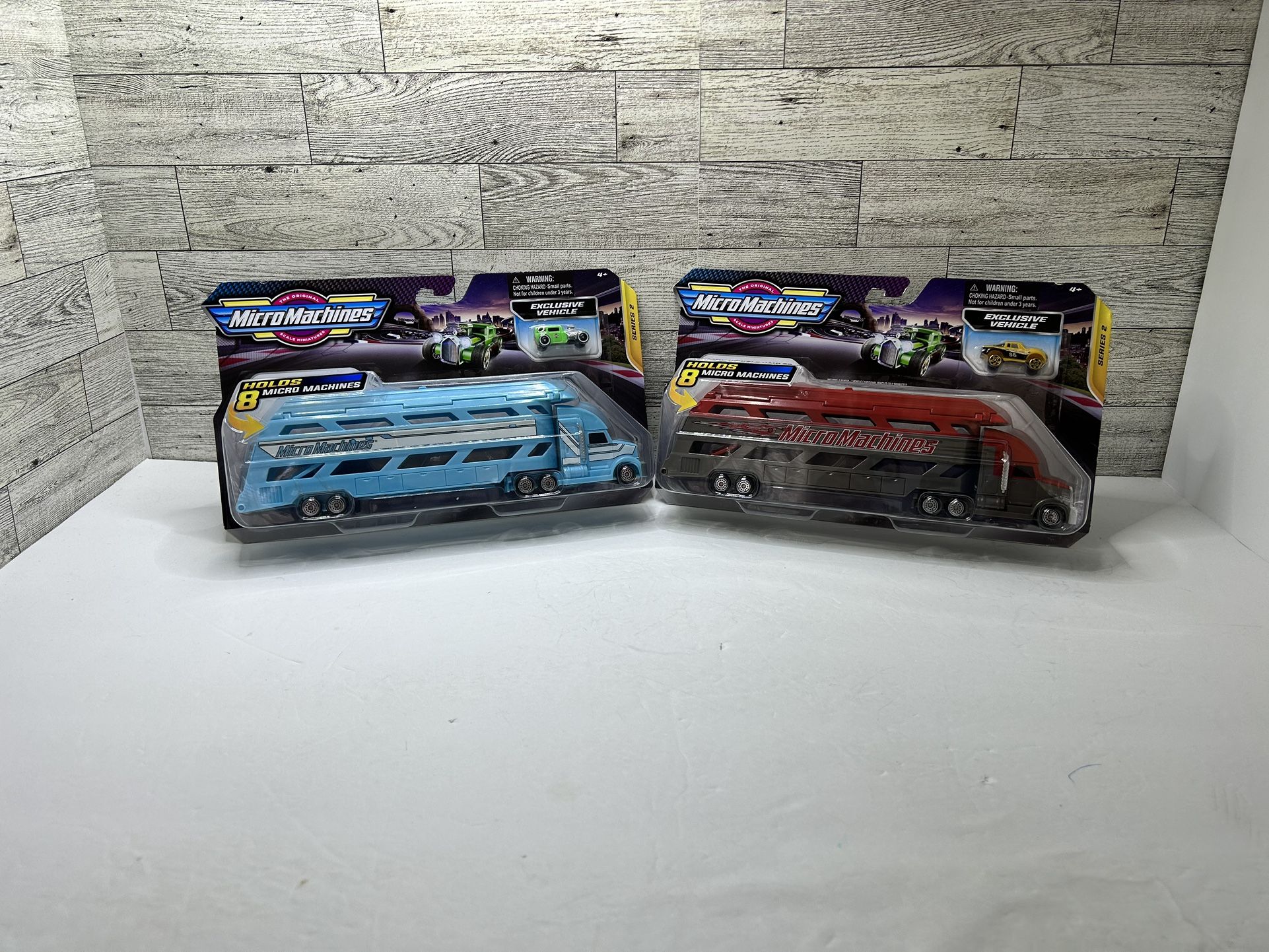 MICRO MACHINES THE ORIGINAL SCALE MINIATURES TWO 8 HOLDS MINI VEHICLE PLASTIC HAULERS LIGHT BLUE & RED TRUCKS • WITH EXCLUSIVE VEHICLES • MADE IN CHIN