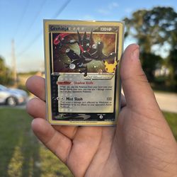 Greninja Gold Star (SWSH144), a Black Star Promo released as part of the Pokémon TCG Celebrations Elite Trainer Box in 2021