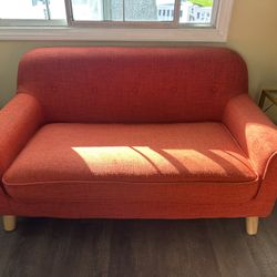 Small orange loveseat - Moving sale! 