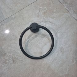 Matt black hand towel holder.