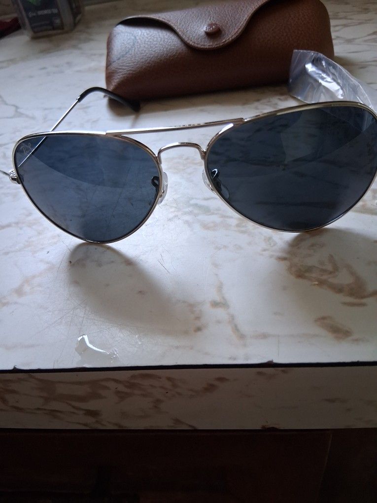 RAY BAN AVIATORS w/ BLUE TINTED LENSES AND POLISHED SILVER FRAME. BRAND NEW. $100 or BEST OFFER.