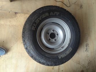 New spare tire old rim off of '94 Chevy 1500 the original spare rim