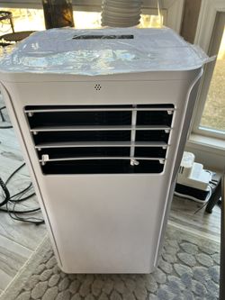 pre-owned 12,000 BTU portable air conditioner unit with automatic condenser removal pump 