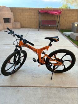 Outroad 26 inch Mountain Bike, 21 speed/high carbon steel frame, and dual disk brake with front and mid suspensions… Orange color.