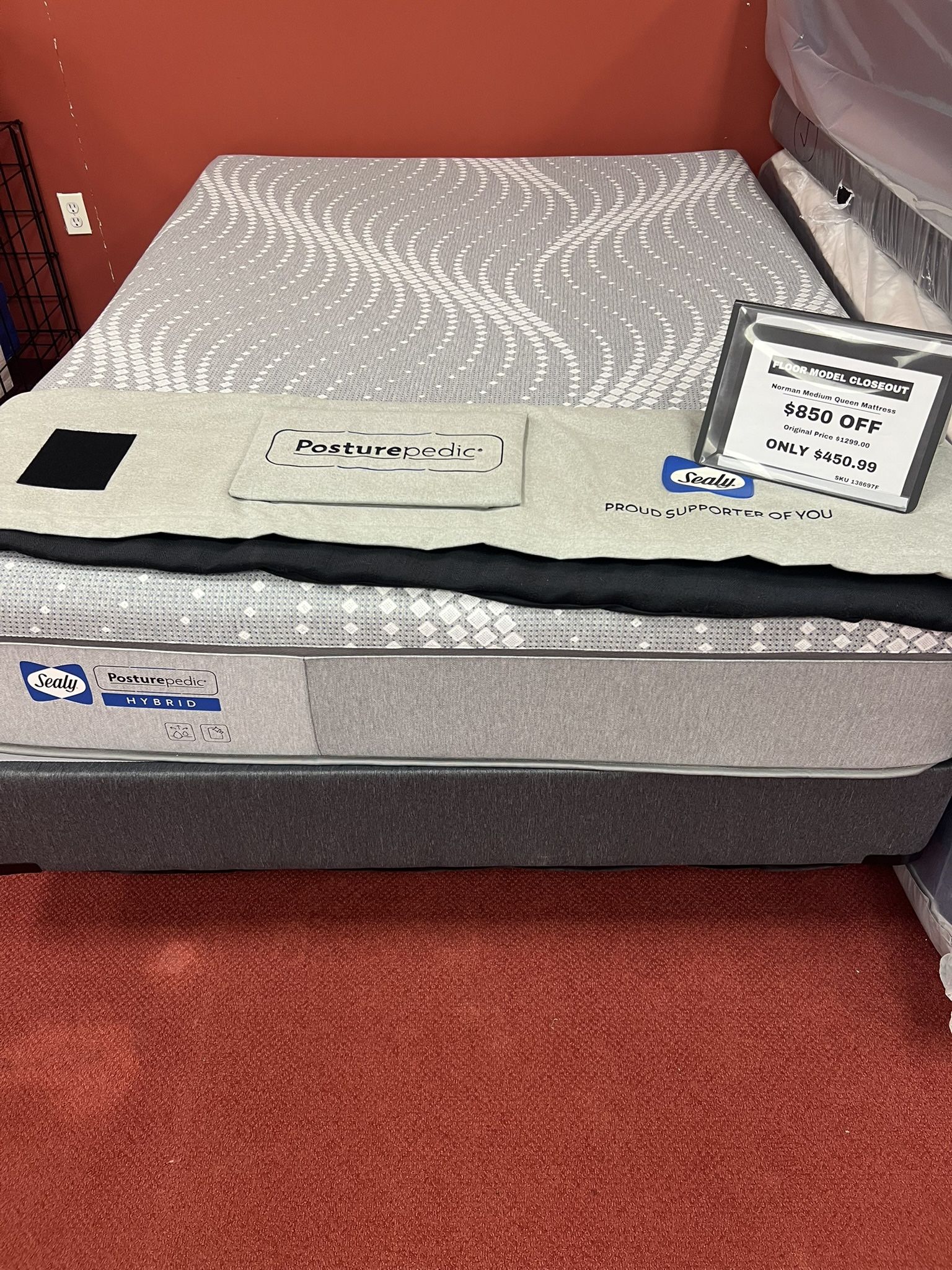 Queen Sealy Posturepedic Hybrid floor model