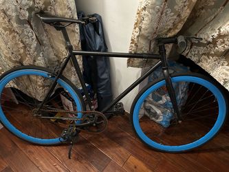 Blue rim fixie bike
