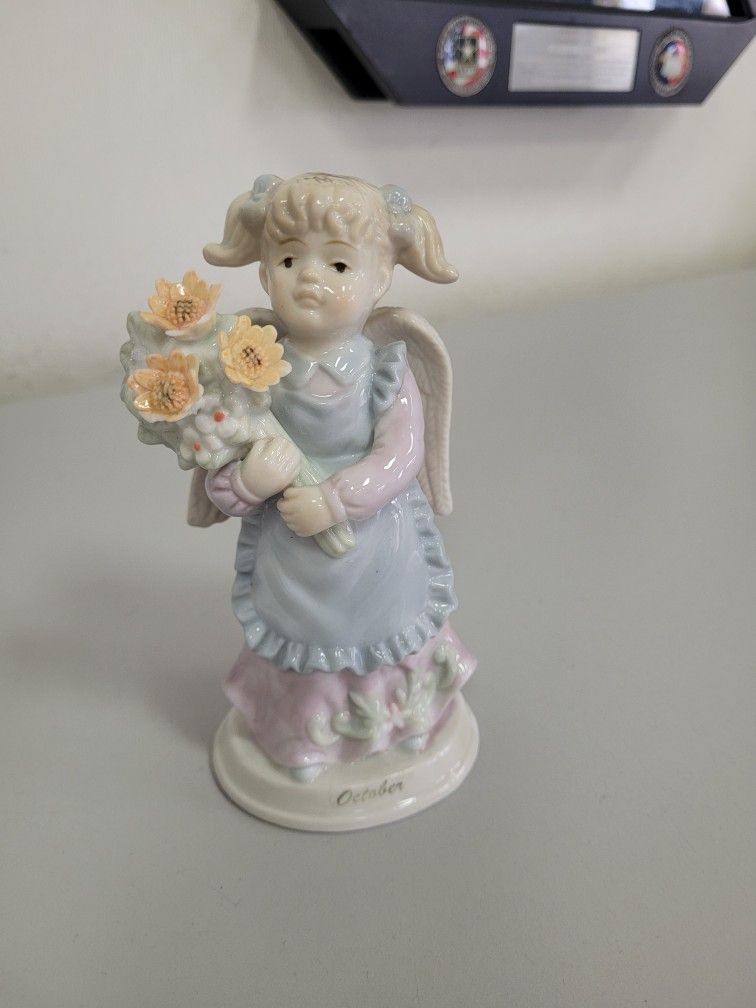 Russ Berrie Vintage Porcelain Angel figurine, from the Russ Berrie "Monthly Angel"
