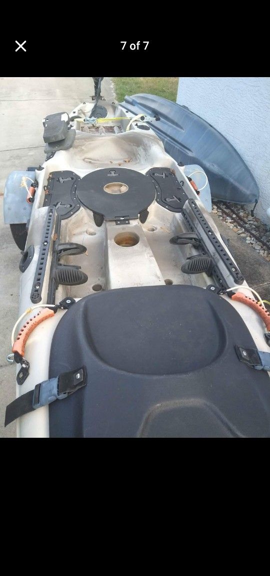 Malibu Stealth 12 fishing kayak with legal trailer, trolling motor, battery, and accessories