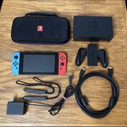 Nintendo Switch console system COMPLETE with dock, ac charger cable, neon red blue joycon controller, straps, joycons grip, hdmi, Travel Case video