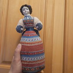 Vintage Avon porcelain doll.  Features a fabric dress. Lavender scented. 