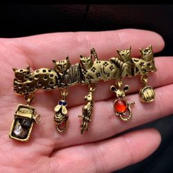 cat brooch with charms mouse parrot mousetrap yarn
