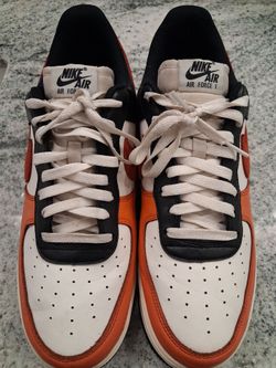 Nike shoes with black soles and orange accents. SIZE "12"