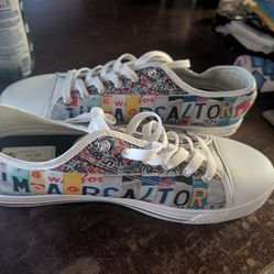 White canvas low-top sneakers - size M10/F12/EU44 with custom "I'M A REALTOR" license plate design.